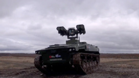 Рогозин показал нового боевого робота с управляемыми ракетами
